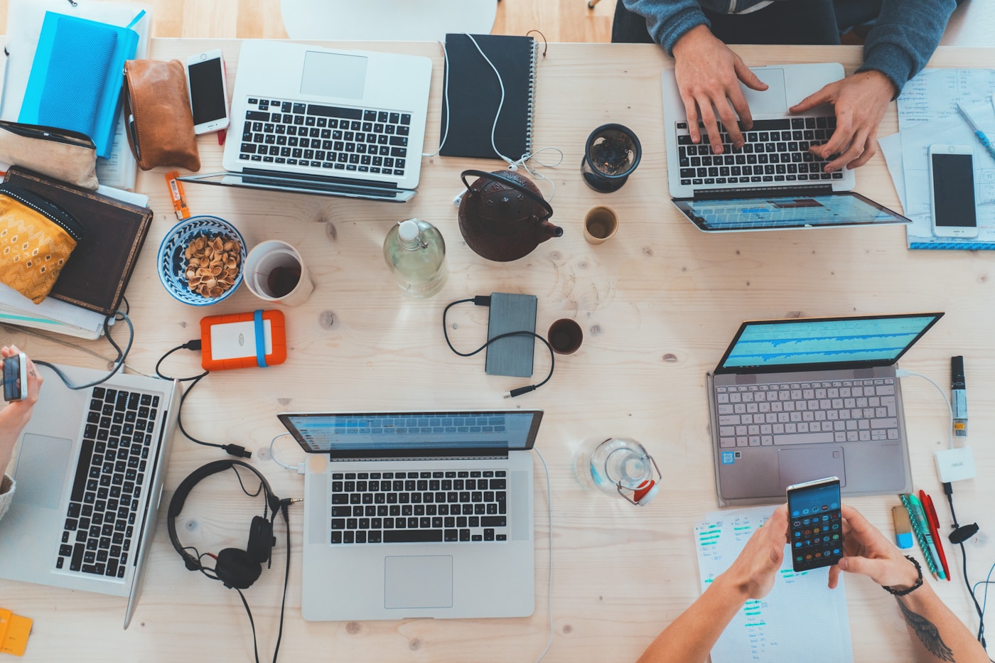 People working together around laptops